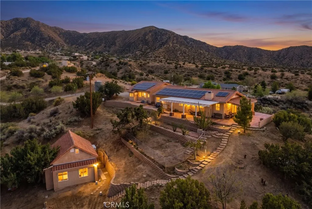 Virtually altered/staged with twilight setting and indoor/outdoor lighting
