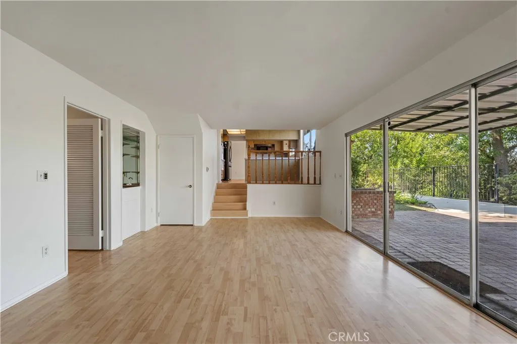 Family room to breakfast area & hall to downstairs bedroom