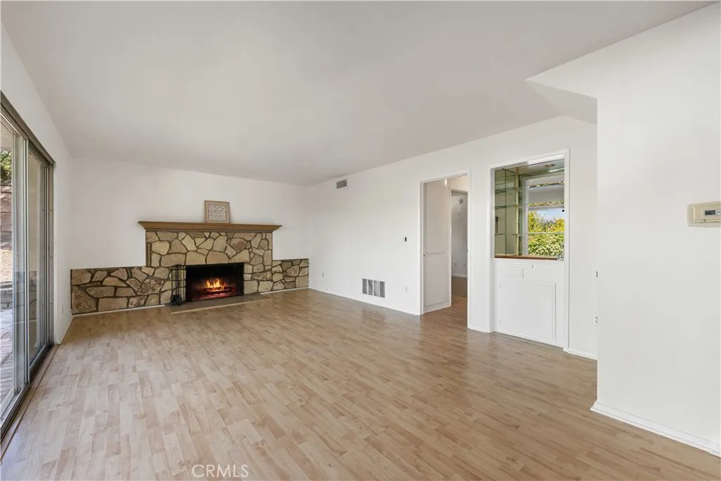 Good-size family room with hallway to downstairs bedroom and three-quarter bath