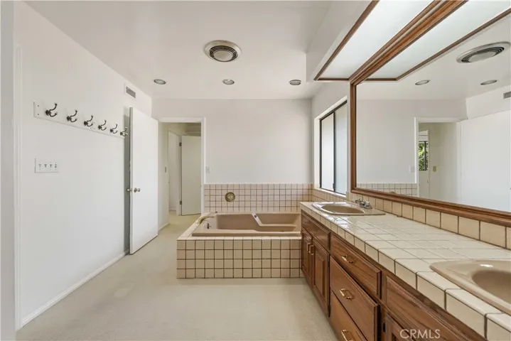 Primary bath opens to walk-in closet