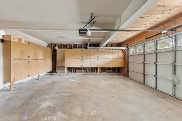 2-car garage with loads of storage cabinets.