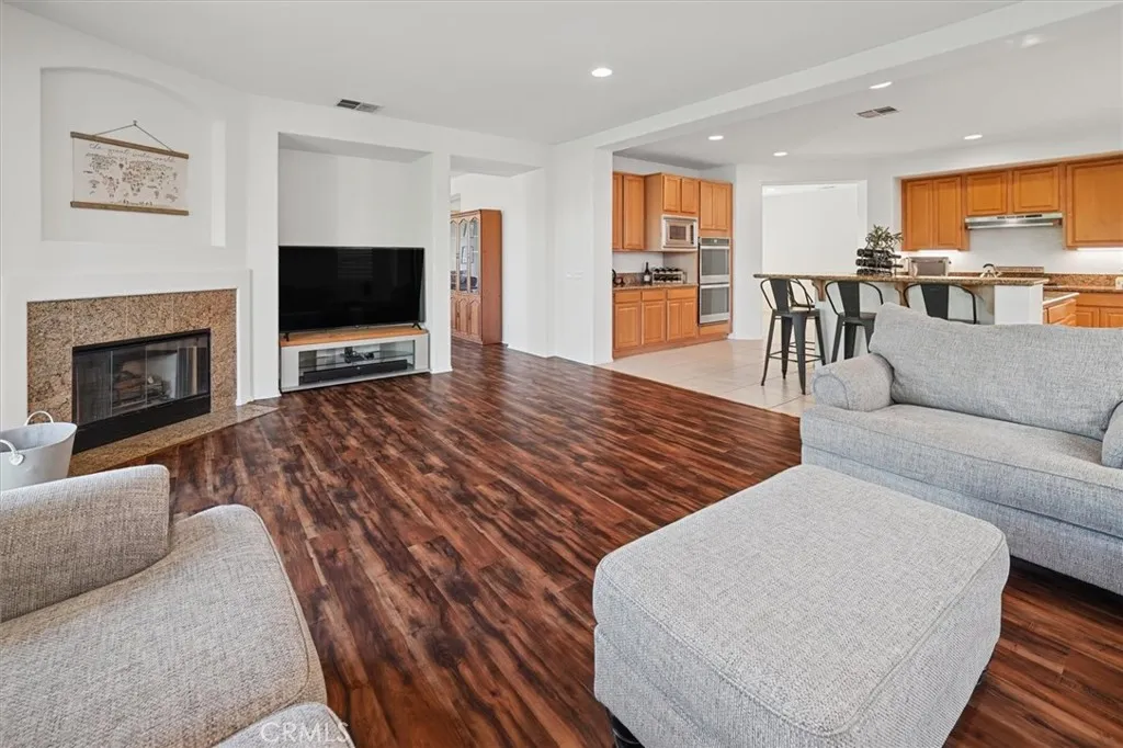 Gather, Relax & Enjoy
Family room with a cozy fireplace and easy flow to the backyard.