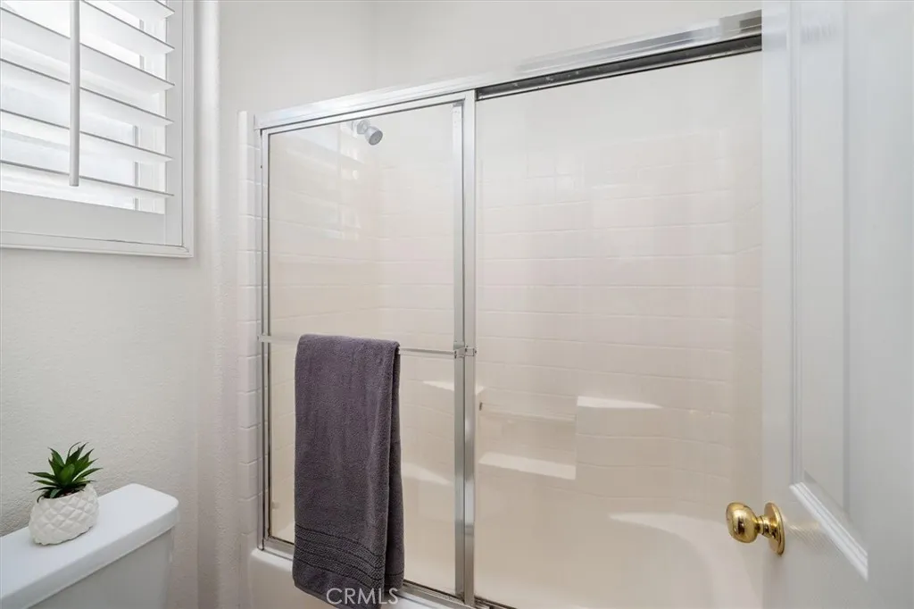 Secondary Bathroom with Dual Sinks & Separate Shower/Toilet Area
