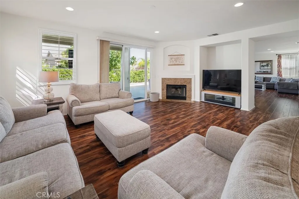Family room with fireplace and open to backyard!