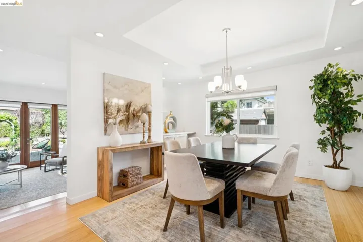 Recessed lighting, tray ceiling, and hard-surface flooring