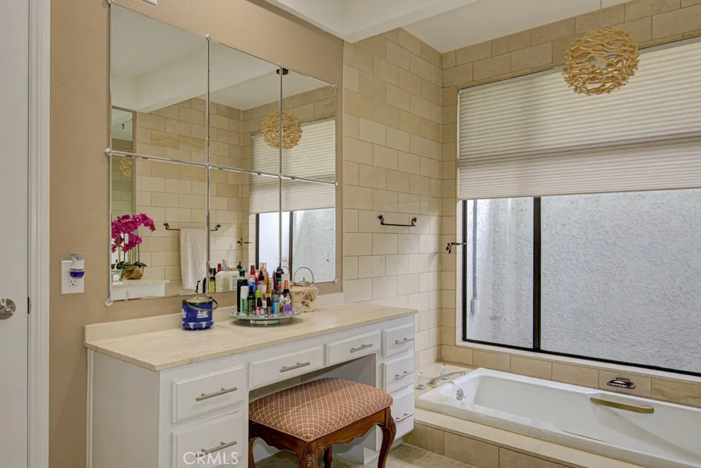 Primary bathroom features a vanity area. Primary bathroom features a vanity area.