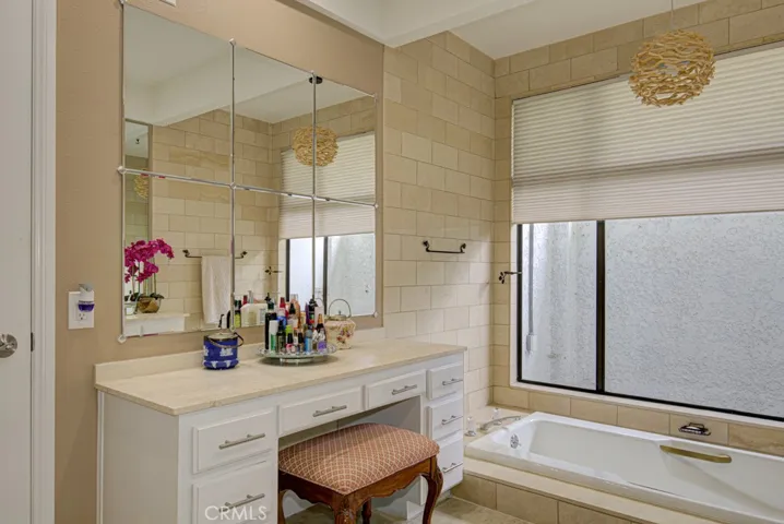 Primary bathroom features a vanity area.