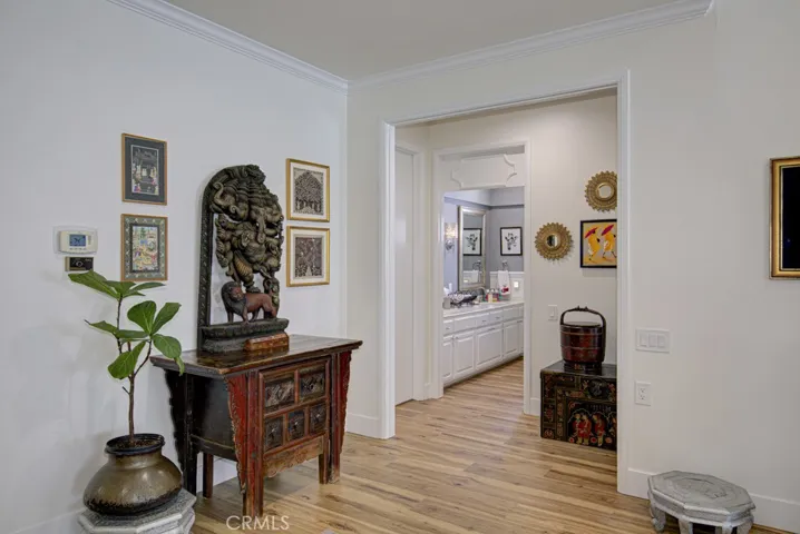 Entry to hallway off the living room leading to guest bedrooms and guest bathroom.