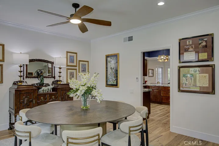 Another view of the dining room. Entry to the kitchen through the door at right.