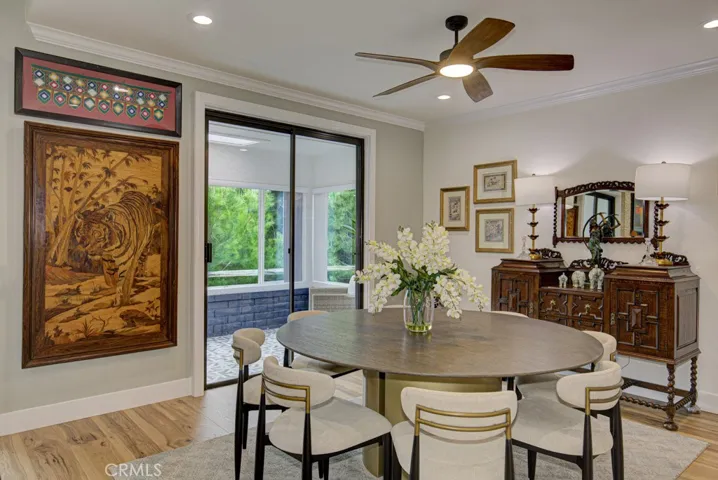 Dining room easily accommodates a large dining table. Note the separate entrance to the enclosed covered rear patio.