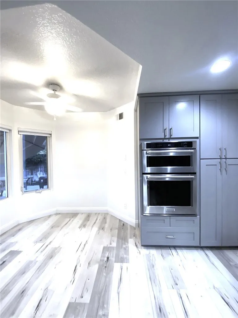 More cabinets and built-in microwave and convection oven. Breakfast nook