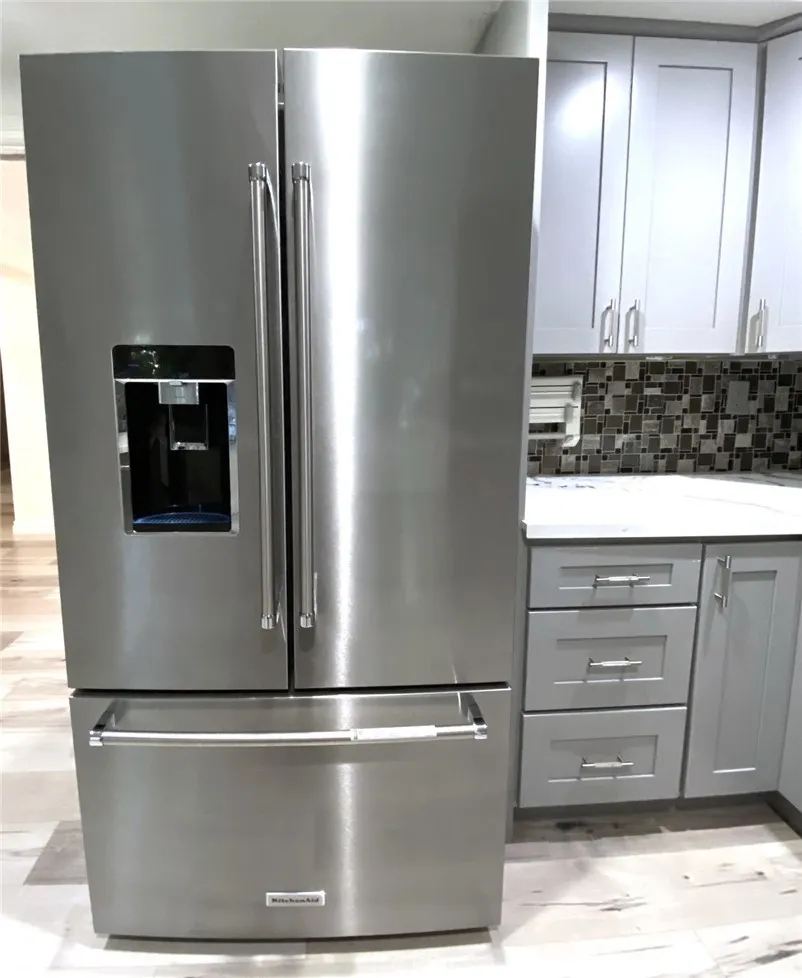 And large newer stainless-steel refrigerator