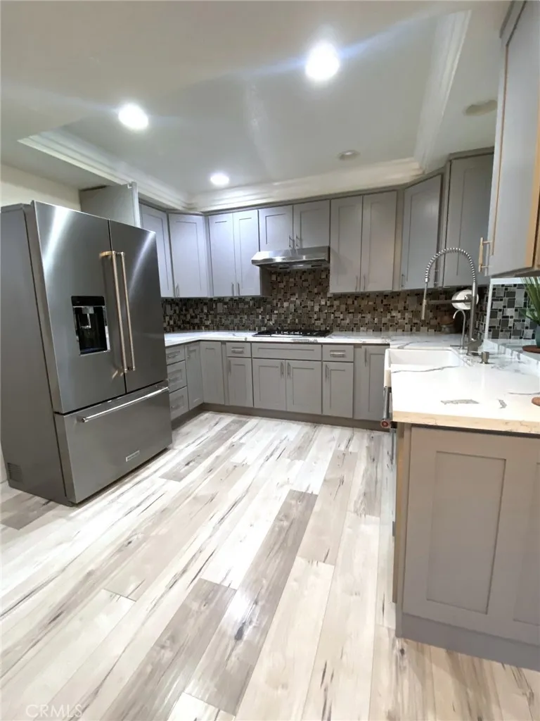 Gourmet kitchen with ample modern cabinets