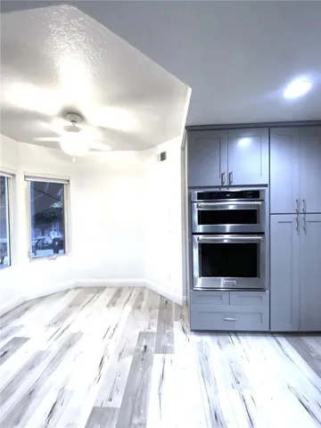 More cabinets and built-in microwave and convection oven. Breakfast nook