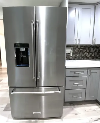 And large newer stainless-steel refrigerator
