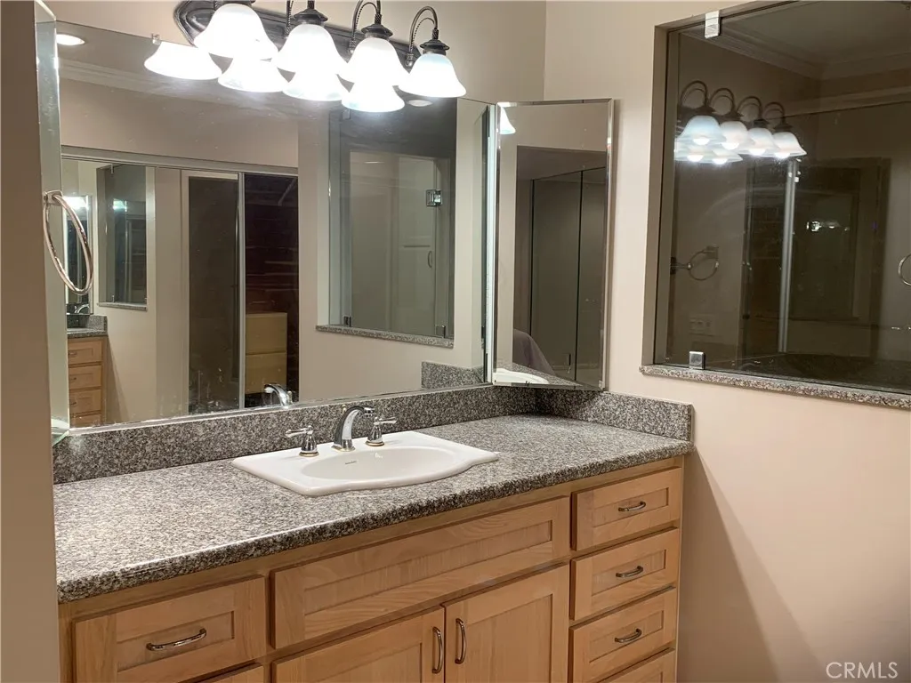 Vanity area in primary bedroom