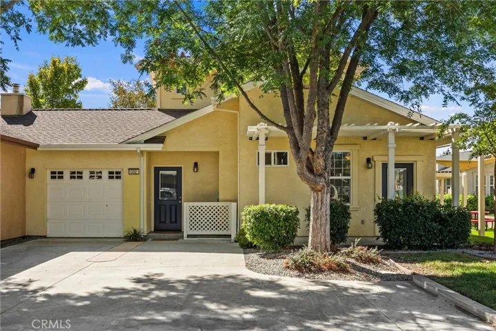 Backyard entrance and garage with 2 parking spots