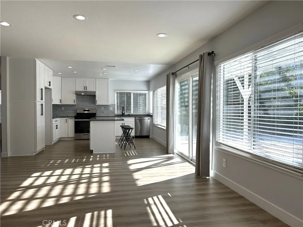 Sun-filled living and dining space overlooking the backyard