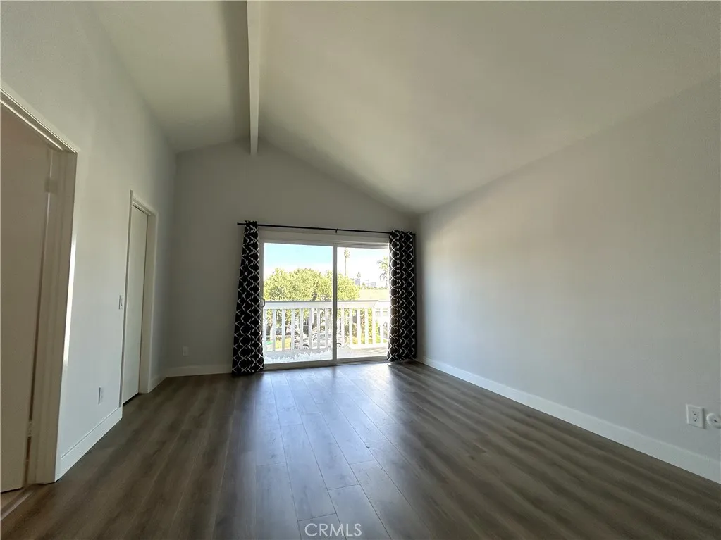 Generous primary bedroom with access to a large private balcony