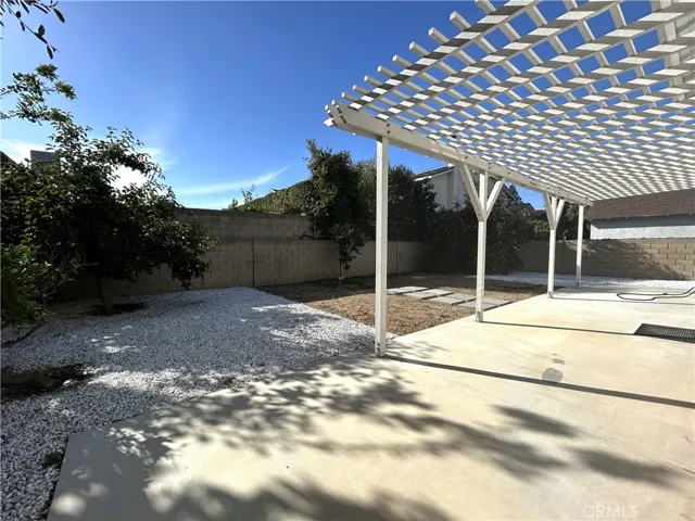 Spacious backyard with mature fruit trees