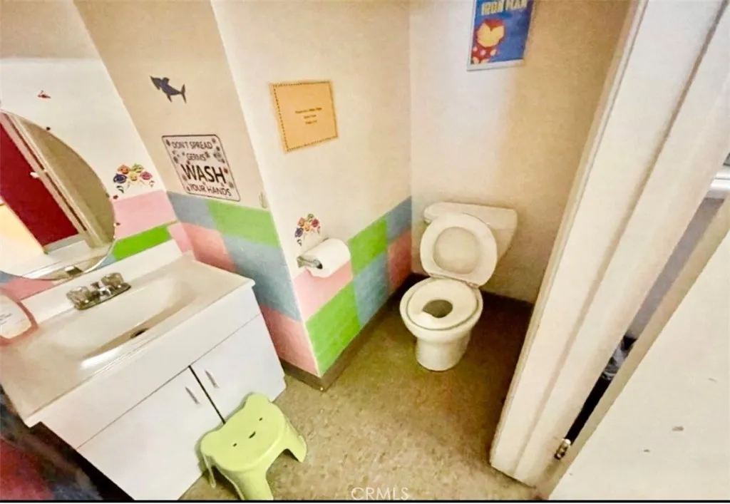 Children's restroom with a potty-training area.