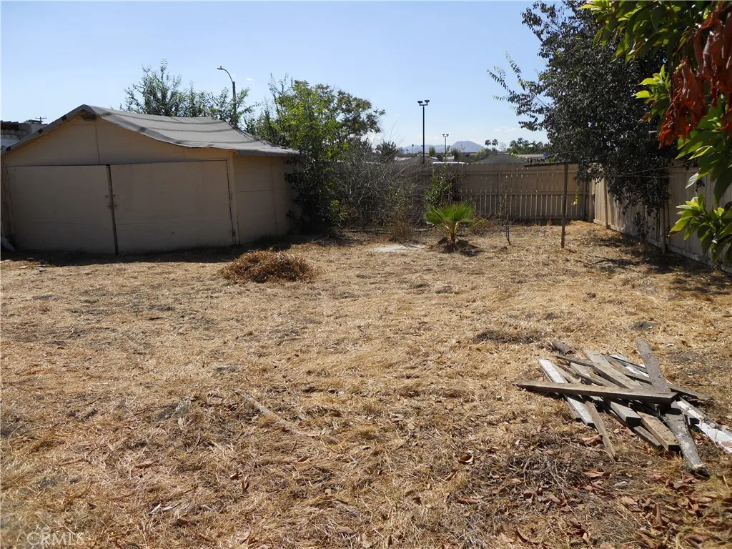 BACK YARD AT THE GARAGE SIDE