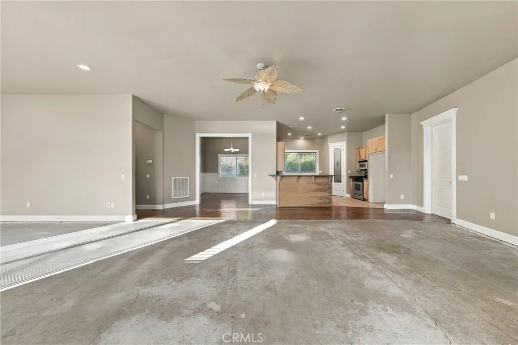spacious living room , just needs you to add carpet spacious living room , just needs you to add carpet