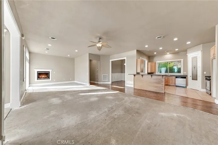 living room with built in propane fireplace