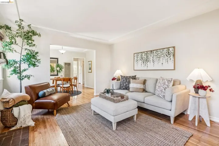 Hardwood flooring, recessed lighting, and a defined living area
