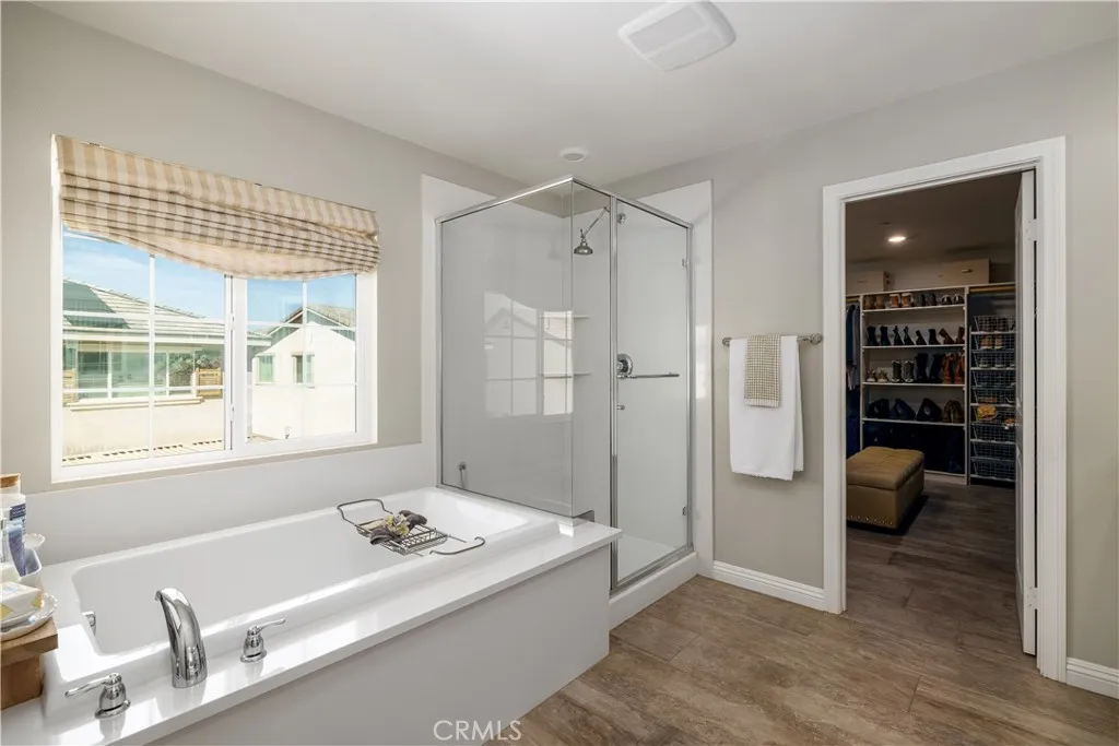 Primary bathroom with separate shower and bathtub.