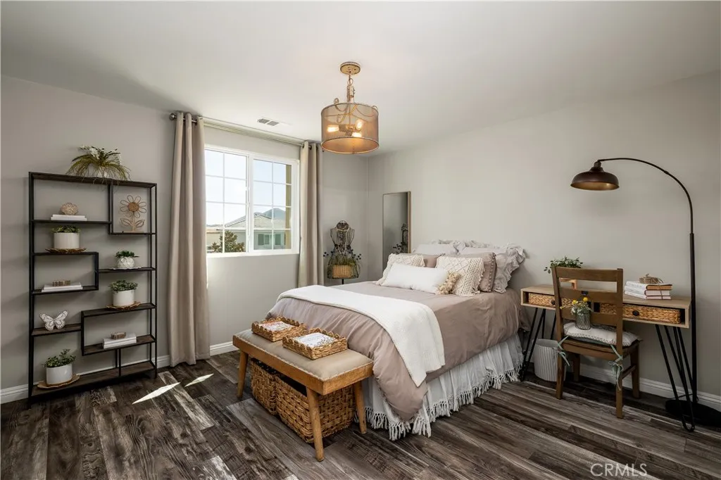 Upstairs secondary bedroom with walk in closet.
