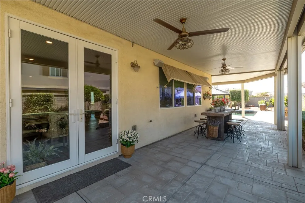 French doors leads to the entertaining backyard.