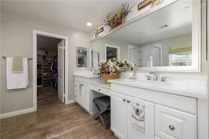 Primary bathroom with huge walk in closet.