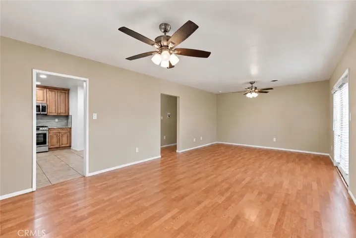 Unstaged/original photo of dining room and living room