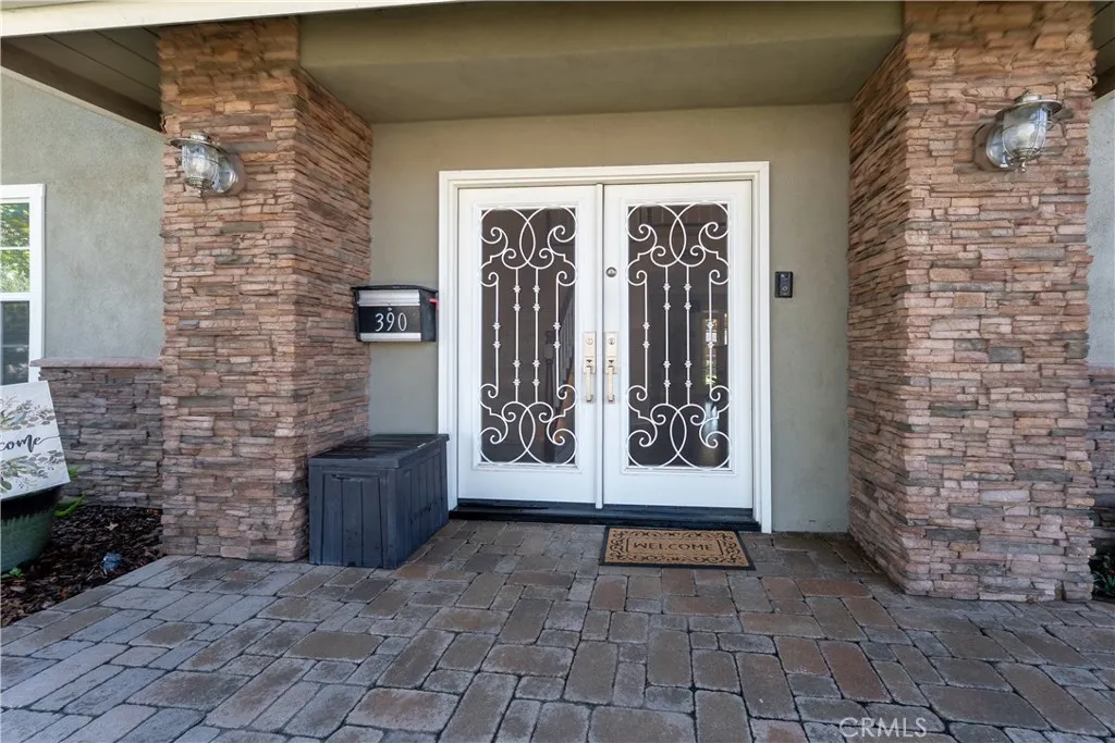 Custom solid steel front entry doors with glass that opens for fresh air.
