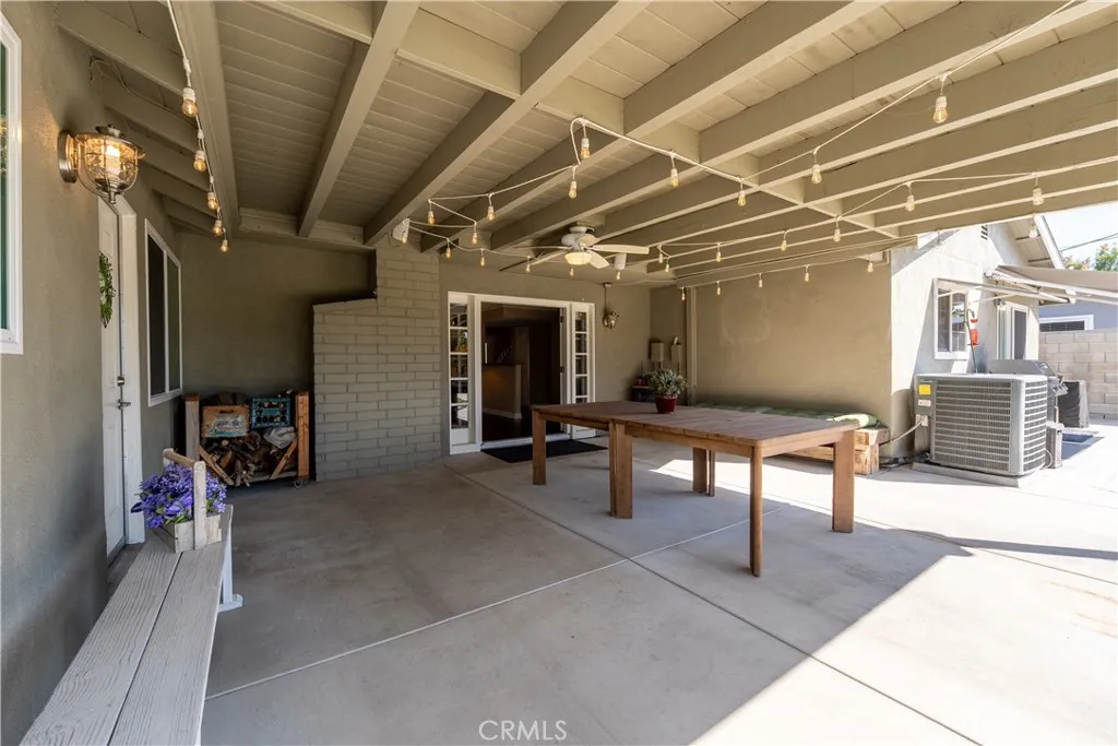  The shot is outside the covered patio, looking into the living room space of the house.