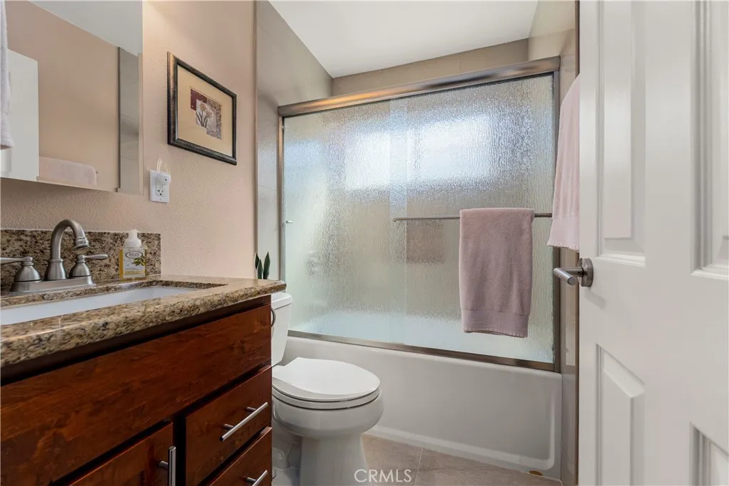 This bedroom outside of the bedroom/office is located at the end of the hallway.