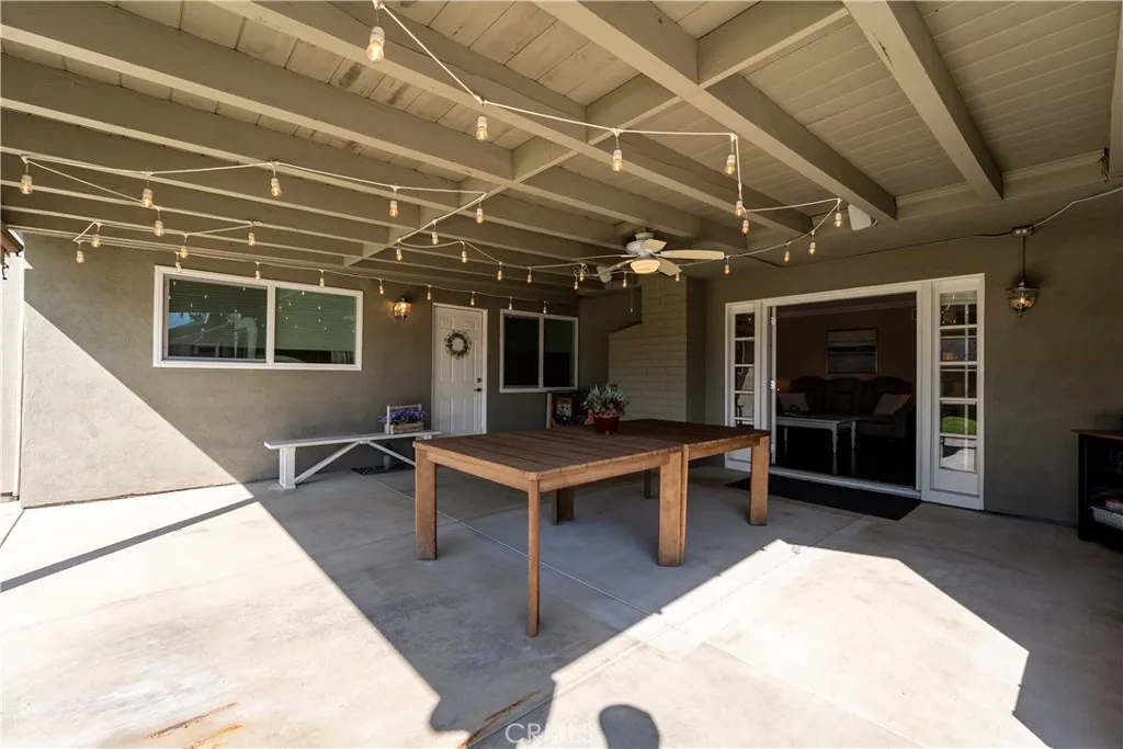  covered patio area, looking into living room area and to the left is the second entry door to the ADU.
