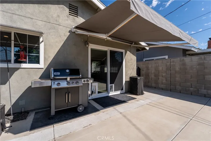  Sliding room door off of kitchen dining area out to backyard towards the Spa.