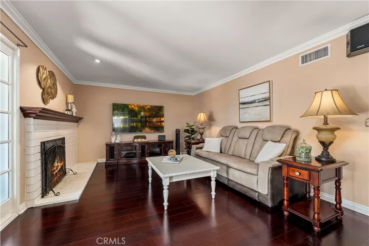 Family room with cozy fireplace.