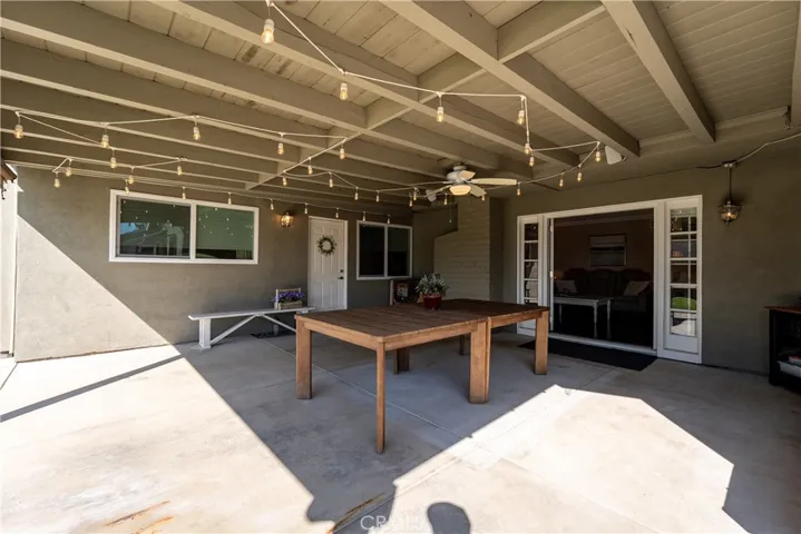  covered patio area, looking into living room area and to the left is the second entry door to the ADU.
