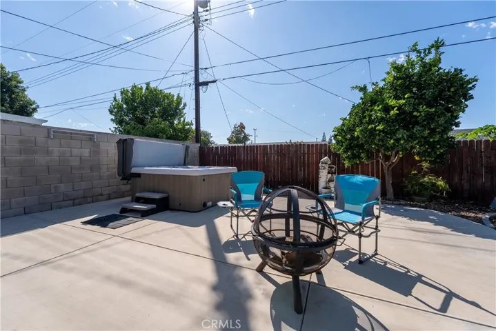 Relaxing Spa on large patio with room for barbecuing, sitting around the fire and enjoying the Orange County lifestyle.
