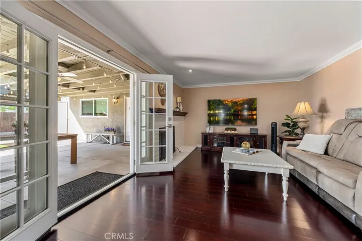 French double doors that lead to covered patio and backyard and ADU.