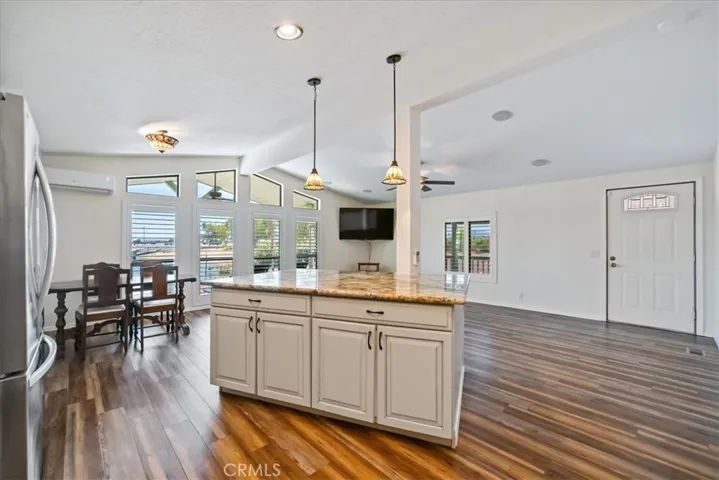 View from kitchen to front door and to the left windows overlooking the boat dock and Jack Smith Park