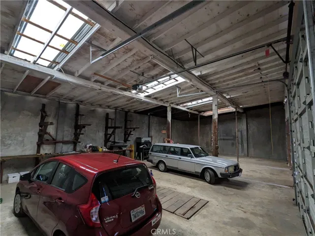 inside separate garage with pit