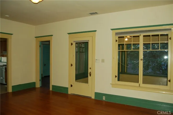 FRONT ROOM ENTRANCE FROM ENCLOSED PORCH