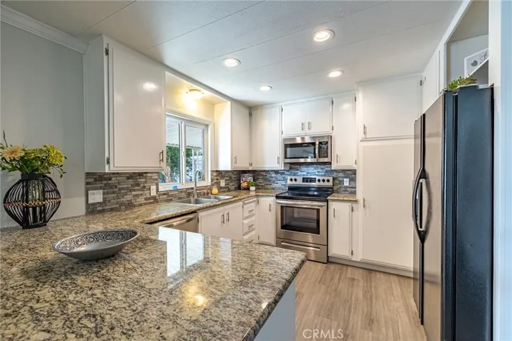Beautiful kitchen with many cabinets for storage