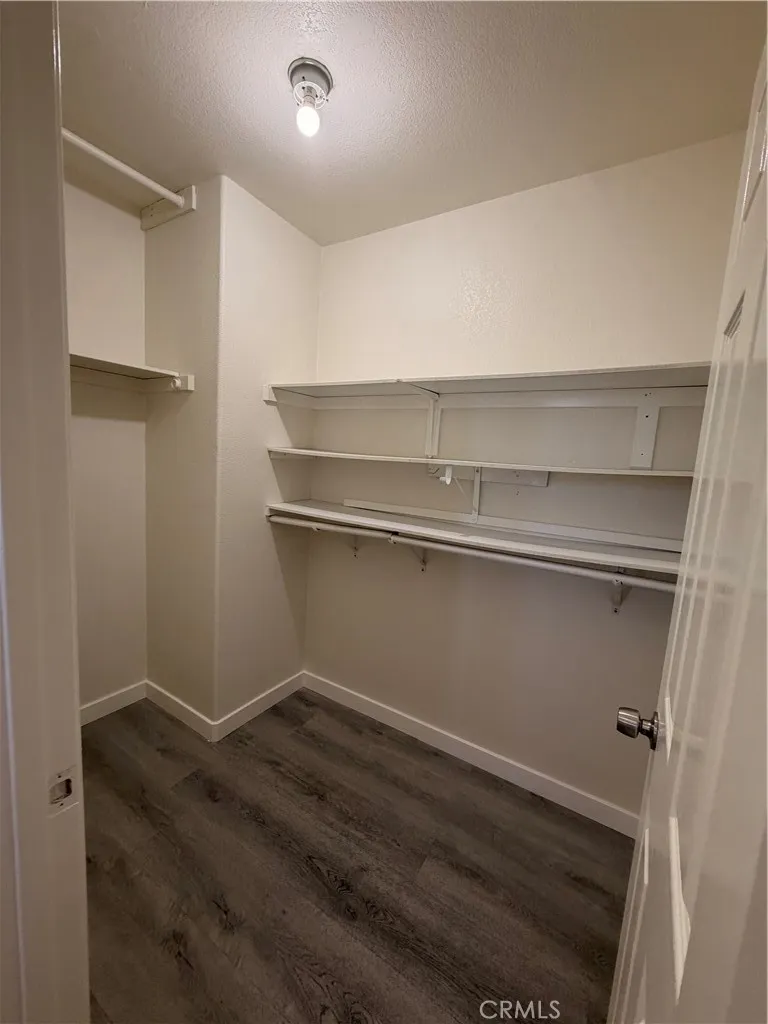 Walk-in closet off of en-suite primary bathroom.