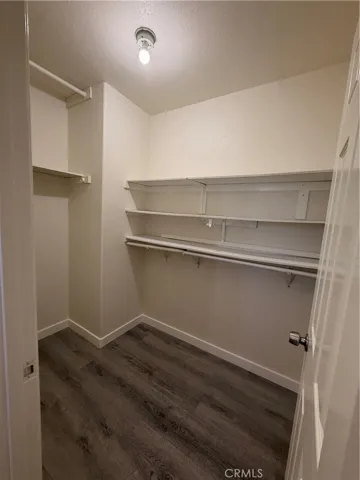 Walk-in closet off of en-suite primary bathroom.