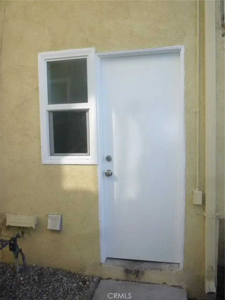 Entry to the community laundry room shared by four units. Entry to the community laundry room shared by four units.